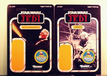 A picture of the Obi-Wan and the Yoda old toy packages (without the toys)