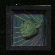 The Yoda side of the Yoda / Darth Vader magic cube Taco Bell Toy