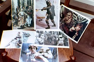 8 by 10 pictures of Star Wars characters, including Yoda on Luke's back