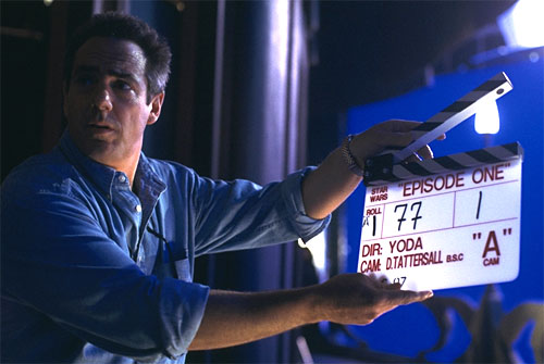 Rick McCallum (Episode I Producer) holding a clapboard.  Notice who's directing the shot