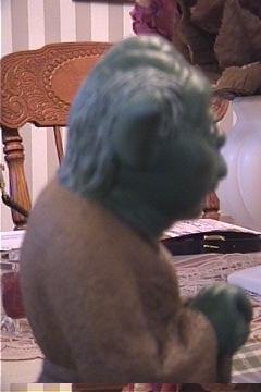 Top right side view of a vintage Mexican Yoda bank