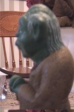 Top left view of a vintage Mexican Yoda bank