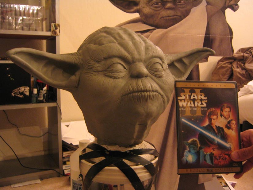 Custom Yoda sculpture near the Attack of the Clones DVD for a size comparison