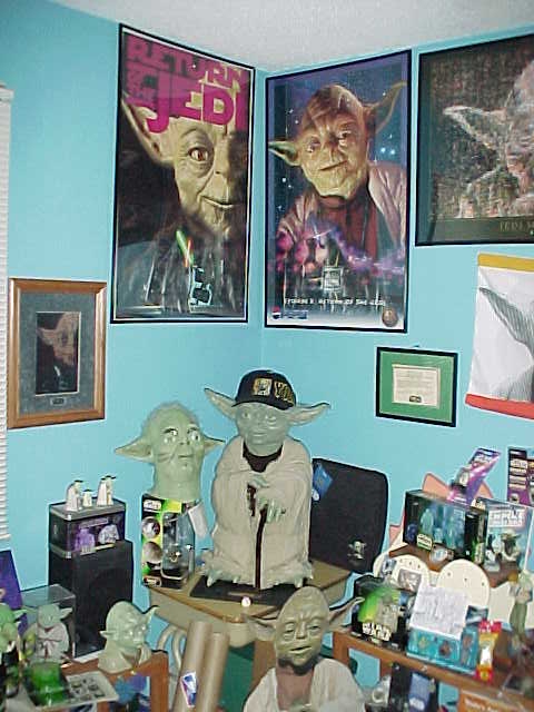 A bunch of Yoda collectibles