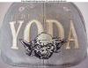 Zoom-in of the logo on the Yoda the Jedi Master hat - 640x494